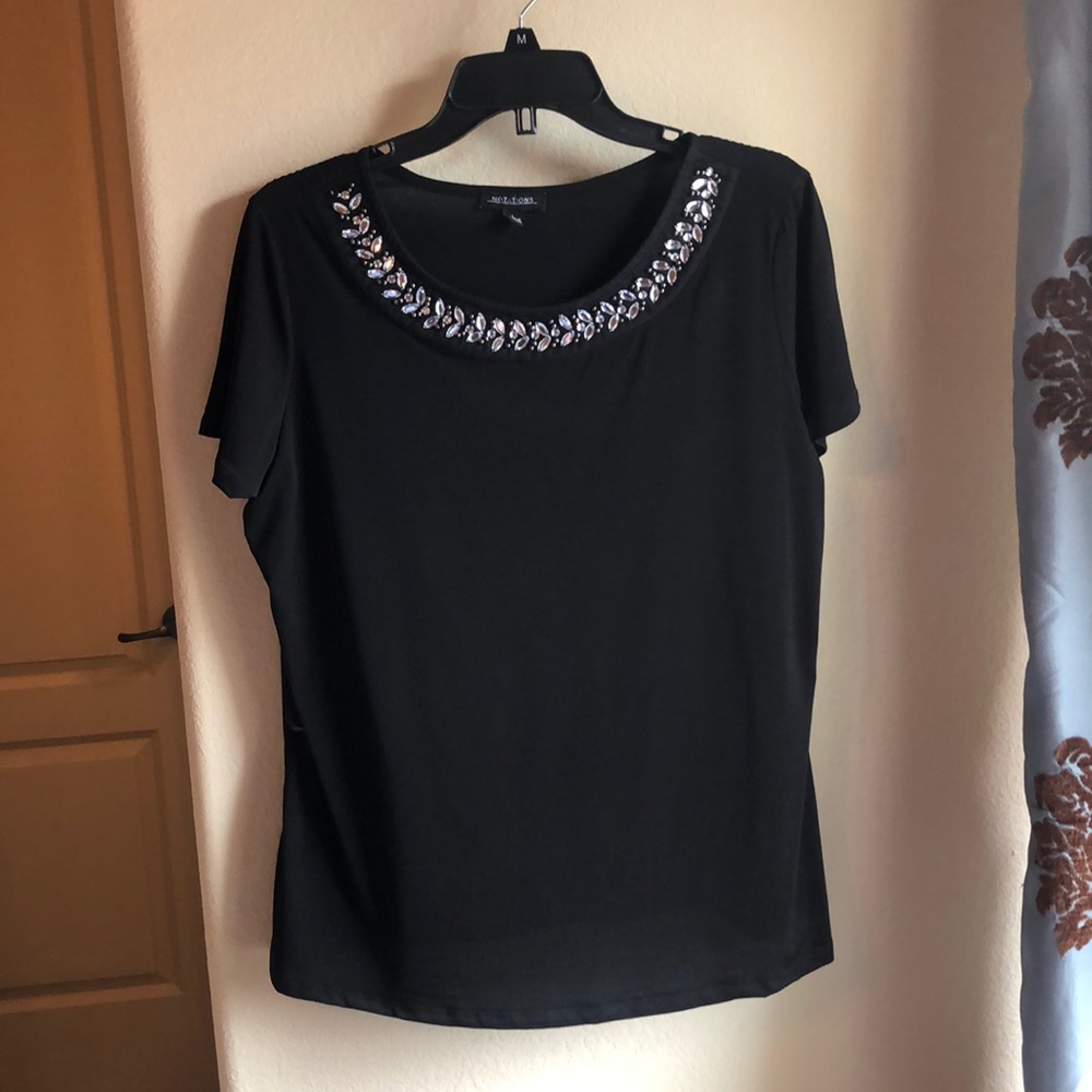 Black top size large with embellished neckline